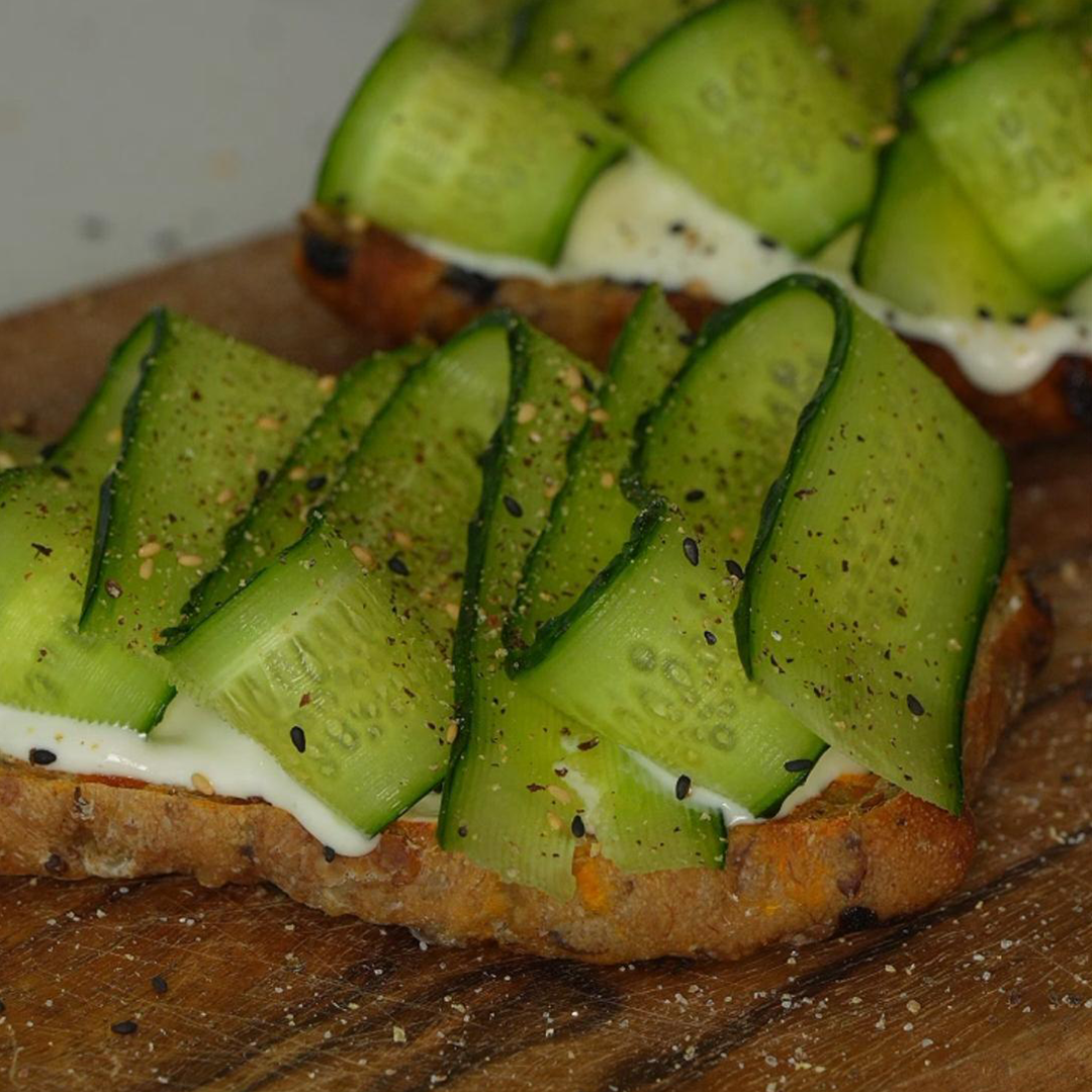 cucumber yogurt toast, cucumber yogurt sourdough toast, country bread toast, healthy cucumber toast, yogurt toast recipe, open faced toast recipe, sourdough breakfast toast, healthy breakfast toast, cucumber ribbon toast, Mediterranean style toast,