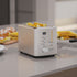 Compact 2-slice toaster on kitchen countertop for everyday breakfast